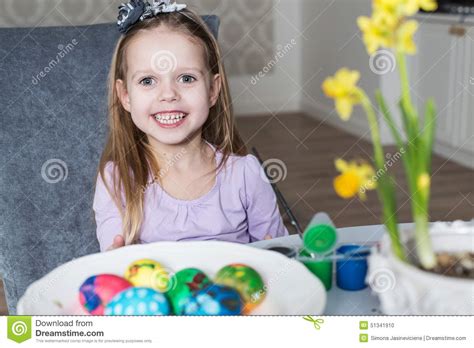 Smiling Little Girl Coloring Easter Eggs Stock Photo Image Of Flowers