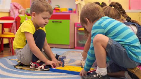 Preschool Education Happy Children In Kindergarten Have Fun Playing