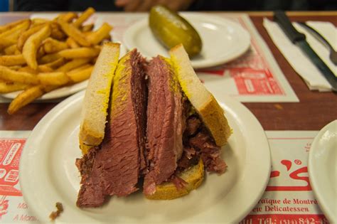 Layer montreal smoked meat over mustard on 2 slices of the bread, dividing evenly. Smoked meat on rye at Schwartz's deli Montreal Canada ...