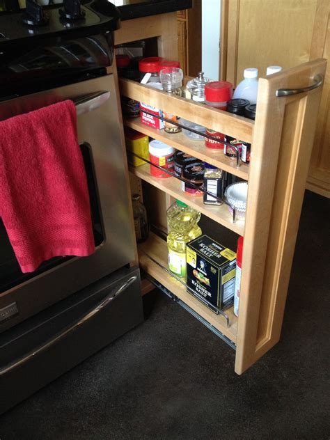 It turns out that this particular drawer isn't meant for storage, but for keeping hot food hot while you wrap up cooking dinner. Pull out spice cabinet next to stove | Dream Home ...