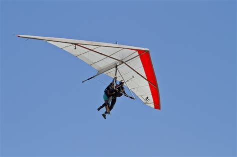 Free Photo Amazing View Of Human Flying On A Hang Glider Isolated On