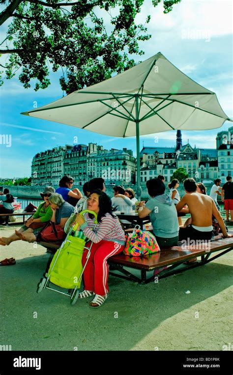 Paris France Public Events People Picnicking On Seine River Quay At