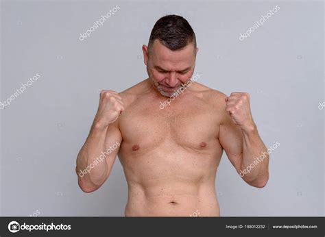 Naked Mature Man Clenching Fists Triumphantly Stock Photo By Info Michaelheim Photographer Com
