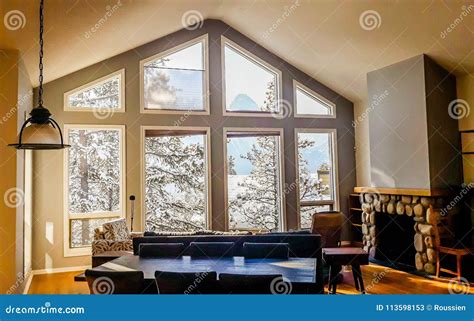 Living Room With Wide Big Windows Typical For Mountain Style In Canada