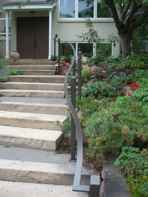 Here in the pacific northwest wooden handrails rot very fast.) for mounting on brick (or concrete), you must use a hammer drill to make a 3 1/2 deep hole with a 1/4 masonry bit. Curved Exterior Handrails - McLean Forge and Welding