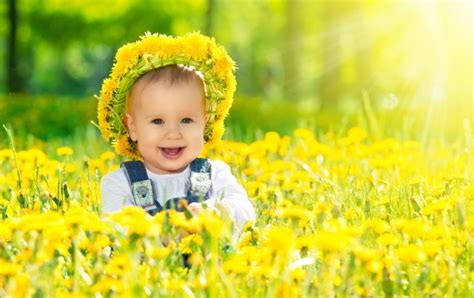 Happy Baby Girl With Yellow Flowers Wallpapers