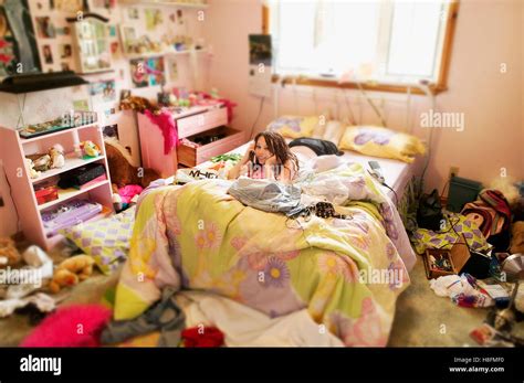 Young Girl In Her Messy Room Stock Photo Alamy