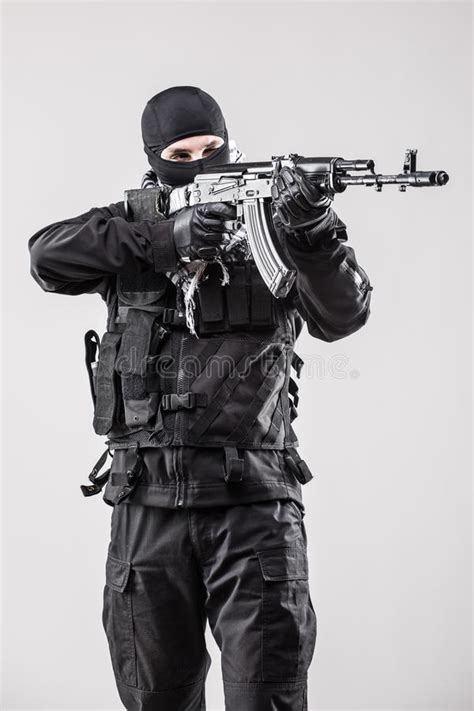 Man Holding A Machine Gun Isolated On White Background Stock Image