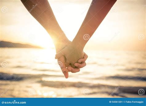 Couple Holding Hands At Sunset Stock Image Image Of Dating Newlywed