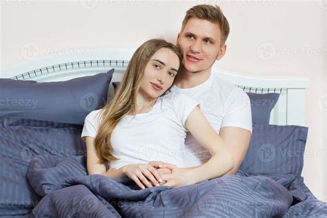 Cute Couple Relaxing On Bed And Hugging Love And Relationships