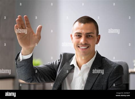 Man Portrait Waving Hello In Video Conference Stock Photo Alamy