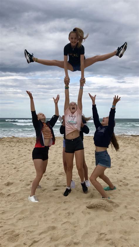 stunting on the beach cheerleading photos cheerleading pictures cheer pictures