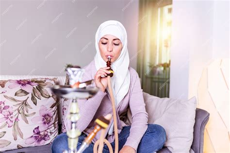 Premium Photo Muslim Woman Smoking Shisha At Home Arab Girl Smoking