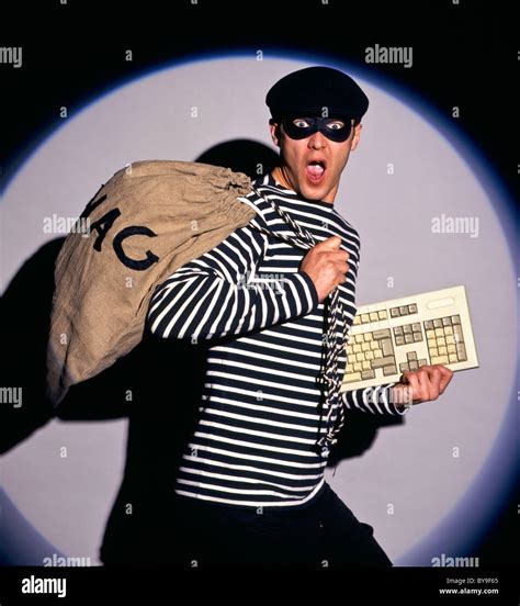 Burglar In Traditional Costume Burglar With Swag Bag And Keyboard