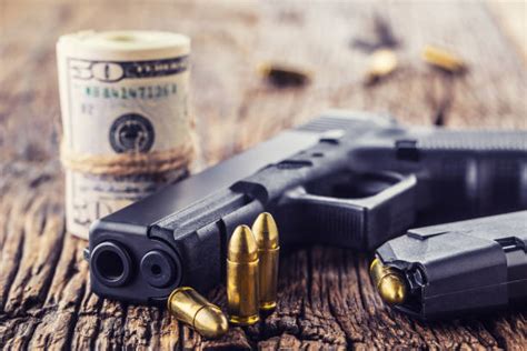 Guns And Money Stock Photos Pictures And Royalty Free Images Istock