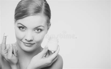 woman applying cream on her skin face stock image image of girl body 66435415