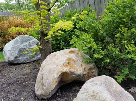 Using Boulders In The Landscape Sweeneys Custom Landscaping Inc