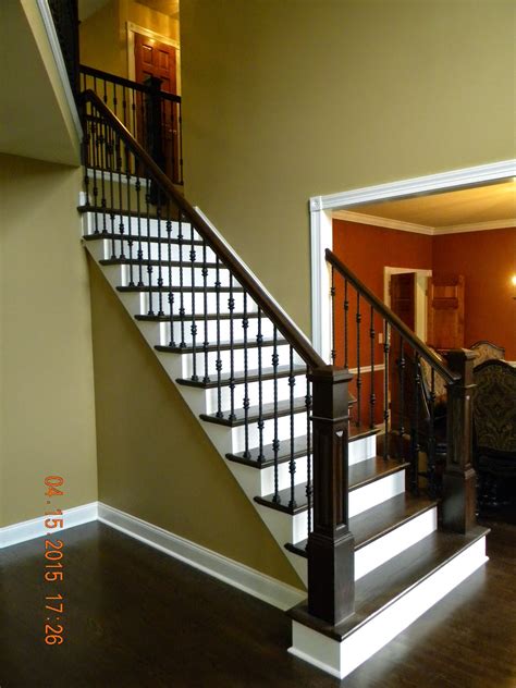Spiral staircase with wood treads and metal spindles. Wood Stairs and Rails and Iron Balusters: Oak Handrail and Box Newels Medford NJ