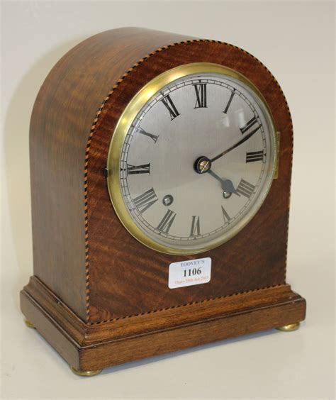 An Edwardian Walnut Cased Mantel Clock With Eight Day Movement