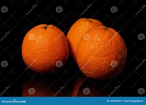 Oranges Fruit On A Black Background With Reflection Stock Image Image