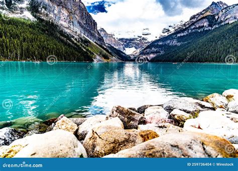 Mesmerizing View Of Turquoise Glacier Fed Louise Lake In Banff
