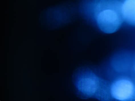 Blureed blue light on a black background free image download