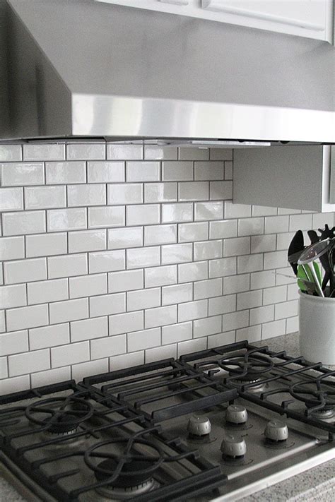 If your tiles are very dark, white grout might look too bright. SUBWAY TILE KITCHEN BACKSPLASH HOW TO - withHEART ...