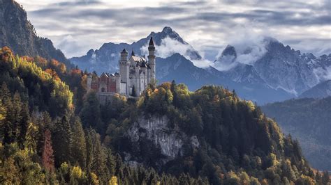 Germany Neuschwanstein Castle Surrounded By Green Trees Covered