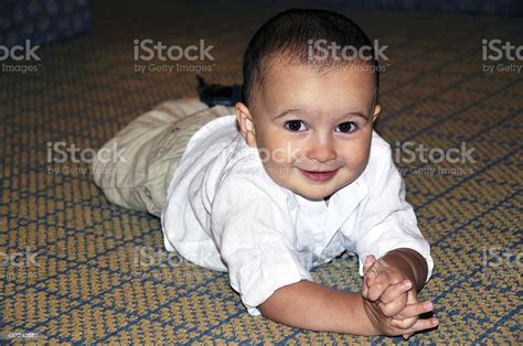 Toddler Laying On The Floor Stock Photo Download Image Now 12 17