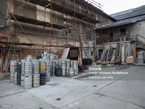 Courtyard Of Beroun Brewery Called Berounsky Medved With Pile Of Empty