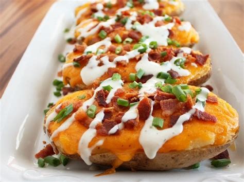 Split the baked potatoes in half and scoop out most of the fluffy flesh with a fork into a bowl. Loaded Twice Baked Potatoes - Cooking Classy