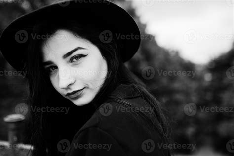 sensual girl all in black red lips and hat goth dramatic woman black and white portrait