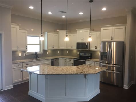 Kitchen with l shaped island. Simple white L shaped kitchen w/island. # ...