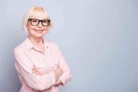 Portrait Of Old Adult Blonde Glad Cheerful Caucasian Lady Smiling