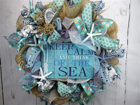 In this example, the piece is made from pinecones to have a. Nautical Beach Seashell Wreath • Home Decor Wreaths ...