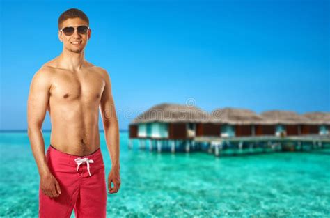 Man On Beach With Water Bungalows Stock Image Image Of Ocean Indian