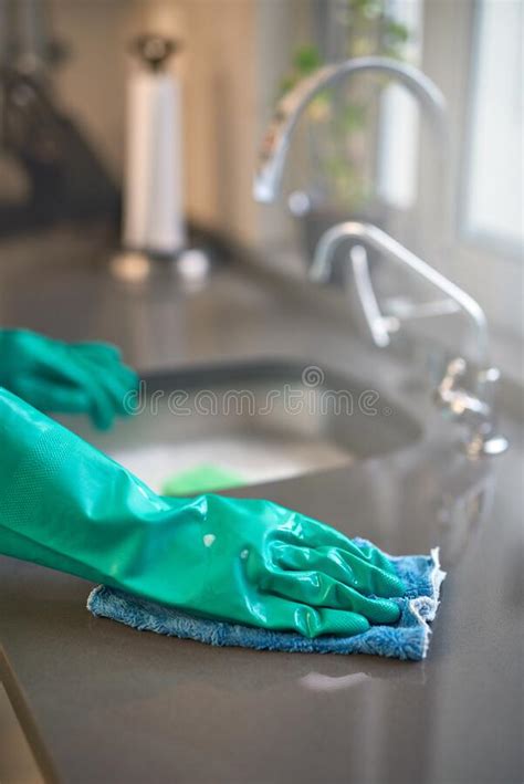 Keeping Things Spotless Closeup Of A Person Cleaning A Kitchen Surface