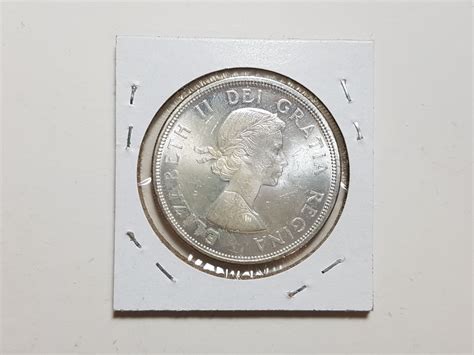 1964 1 Dollar Silver Coin Schmalz Auctions