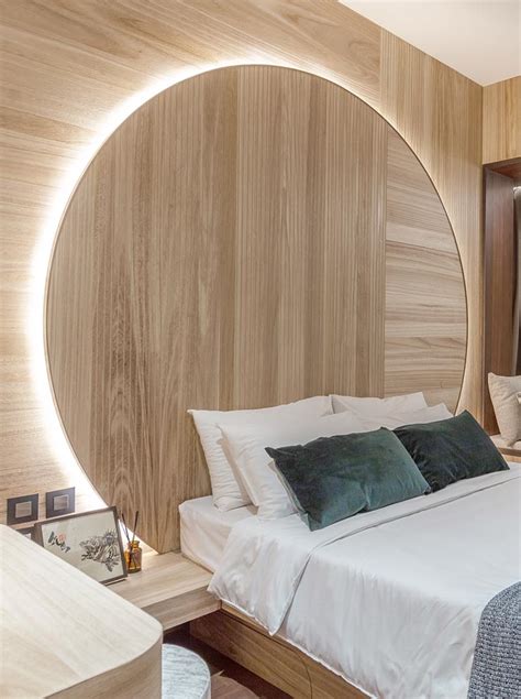 A Backlit Circular Headboard Illuminates This Bedroom