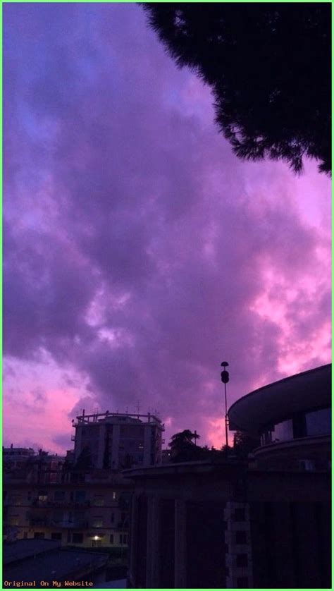 The Sky Is Purple And Pink With Clouds