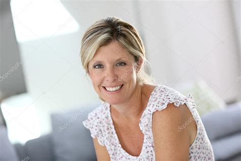 Beautiful 40 Year Old Woman At Home Stock Photo By ©goodluz 58087685