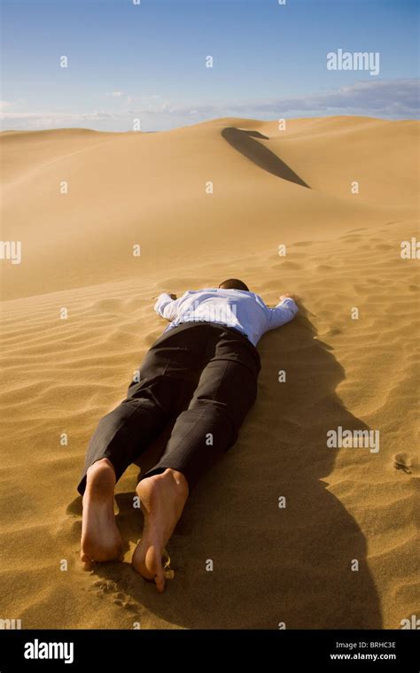 Businessman Dead In The Desert Stock Photo Alamy
