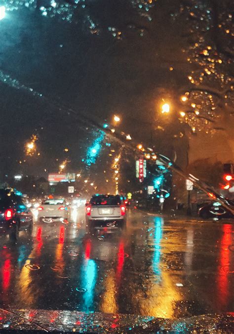 Cars Driving On Asphalt Road During Rainy Night · Free Stock Photo