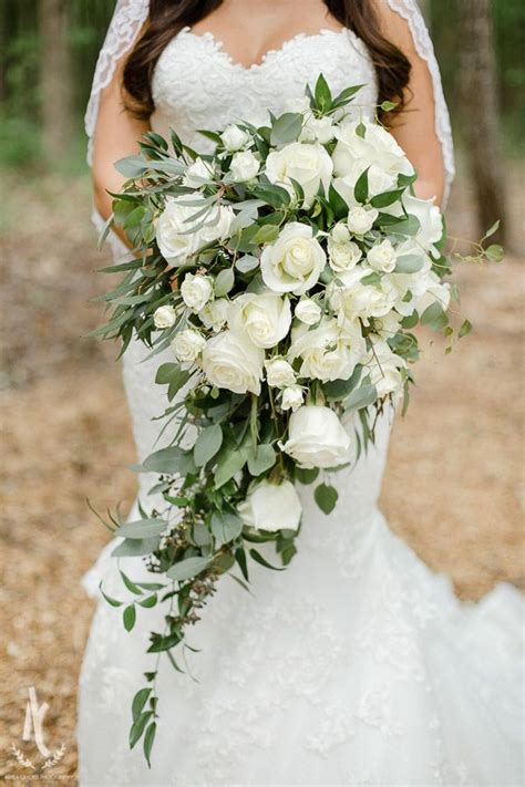 The natural elegance a tulip exudes, whether pastel, vibrant, or crisp white, lends itself to any wedding style. Cathedral bouquet. White roses. Bouquet. Greenery. Wedding ...