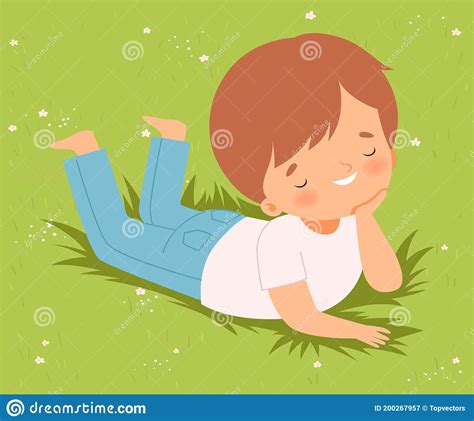 Smiling Boy Lying Down On Green Lawn On His Stomach Cute Kid Having