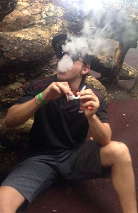 darwin teen posts photo on facebook smoking bong while wearing stolen police cap au