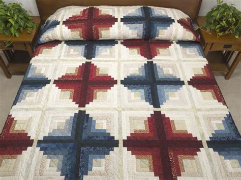 Many quilters love log cabin quilt pattern layouts because of the design's history and the interpretation these quilts feature traditional log cabin quilt blocks, as well as variations, such as chevron and courthouse steps quilt blocks. Blues and Reds Log Cabin Variation Queen Size Bed Quilt