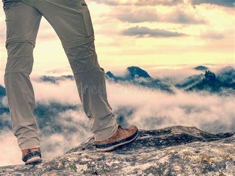 Trekking Shoe And Legs On Rocky Hiking Trail In Mountains Stock Image
