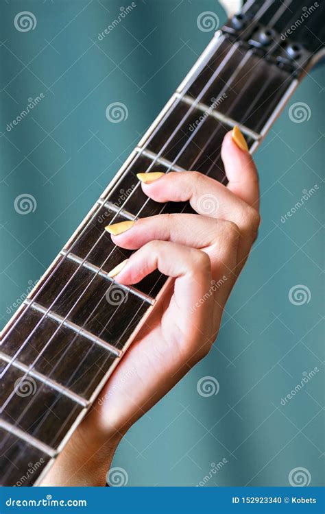 Close Up Of Female Hand Holding Electric Guitar Stock Photo Image Of