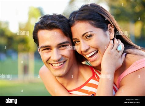 Outdoor Portrait Of Romantic Young Couple In Park Stock Photo Alamy